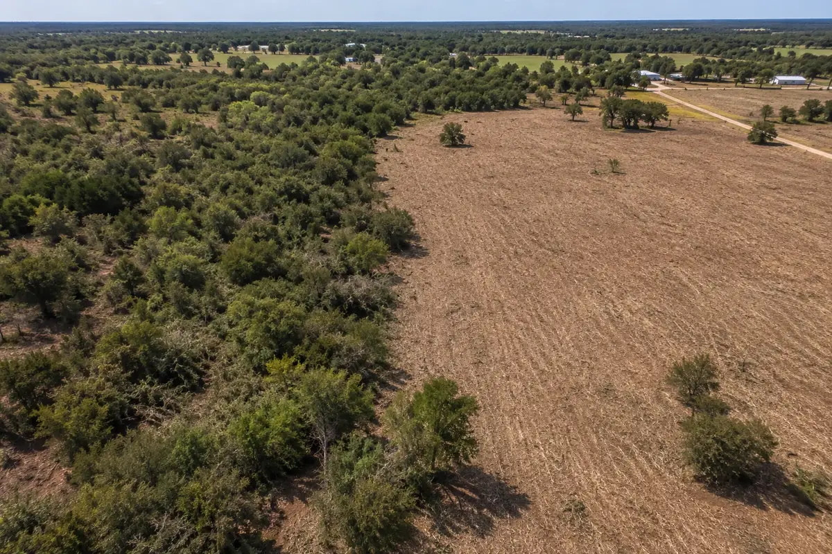 Aerial view of cleared ground after brush removal on a rural property